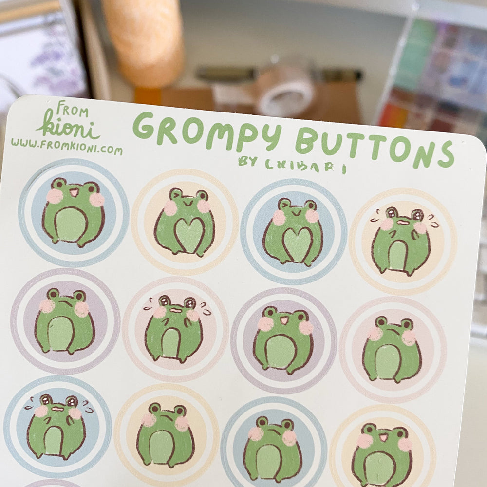 
            
                Load image into Gallery viewer, From Kioni Chibari Spring Collection Grompy the Frog Buttons Sticker Sheet
            
        