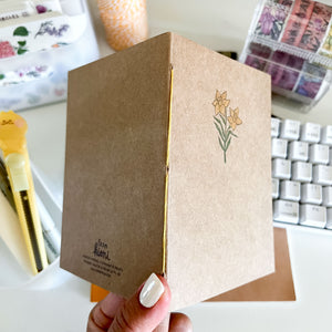 From Kioni Floral Renewal Huney Pika Press Daffodil Handmade Notebook, 4.25x5 in.-1